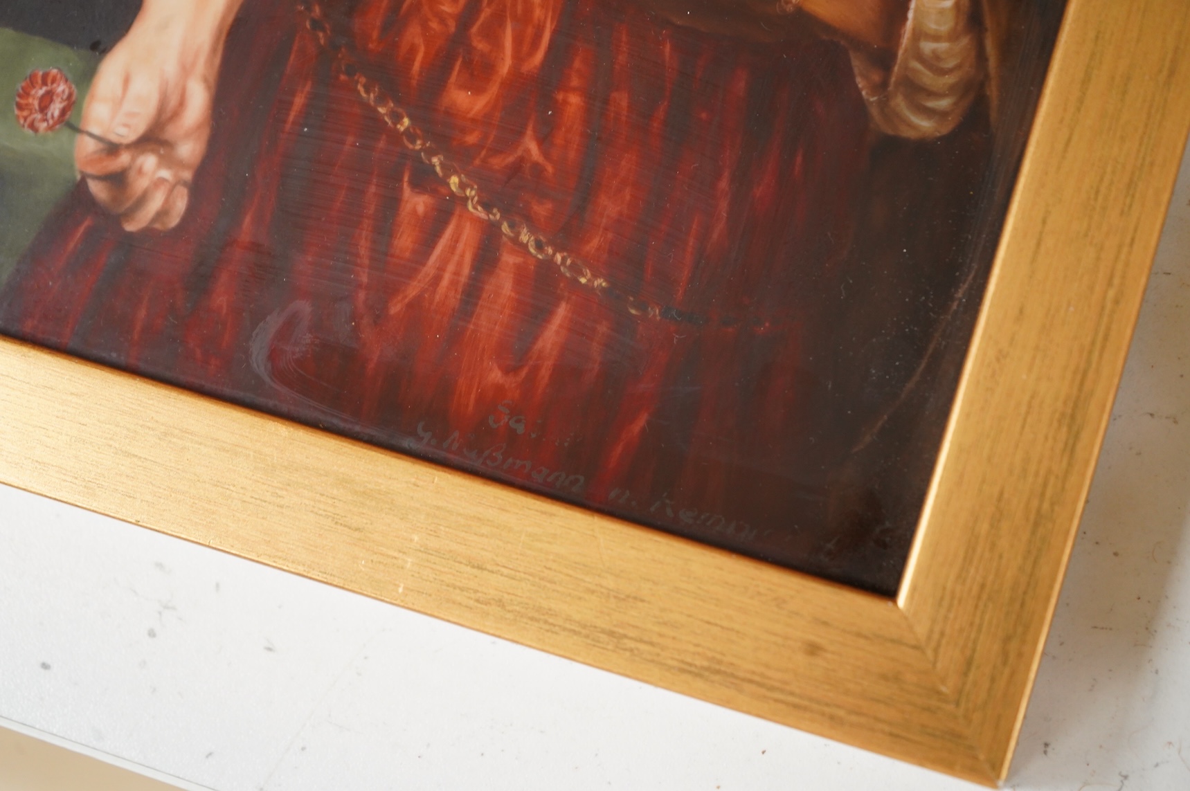 A Continental painted porcelain plaque of Saskia van Uylenburgh, after Rembrandt, together with another plaque of a young girl and her dog, after John Russell (2), Largest 17cm wide x 24cm high.